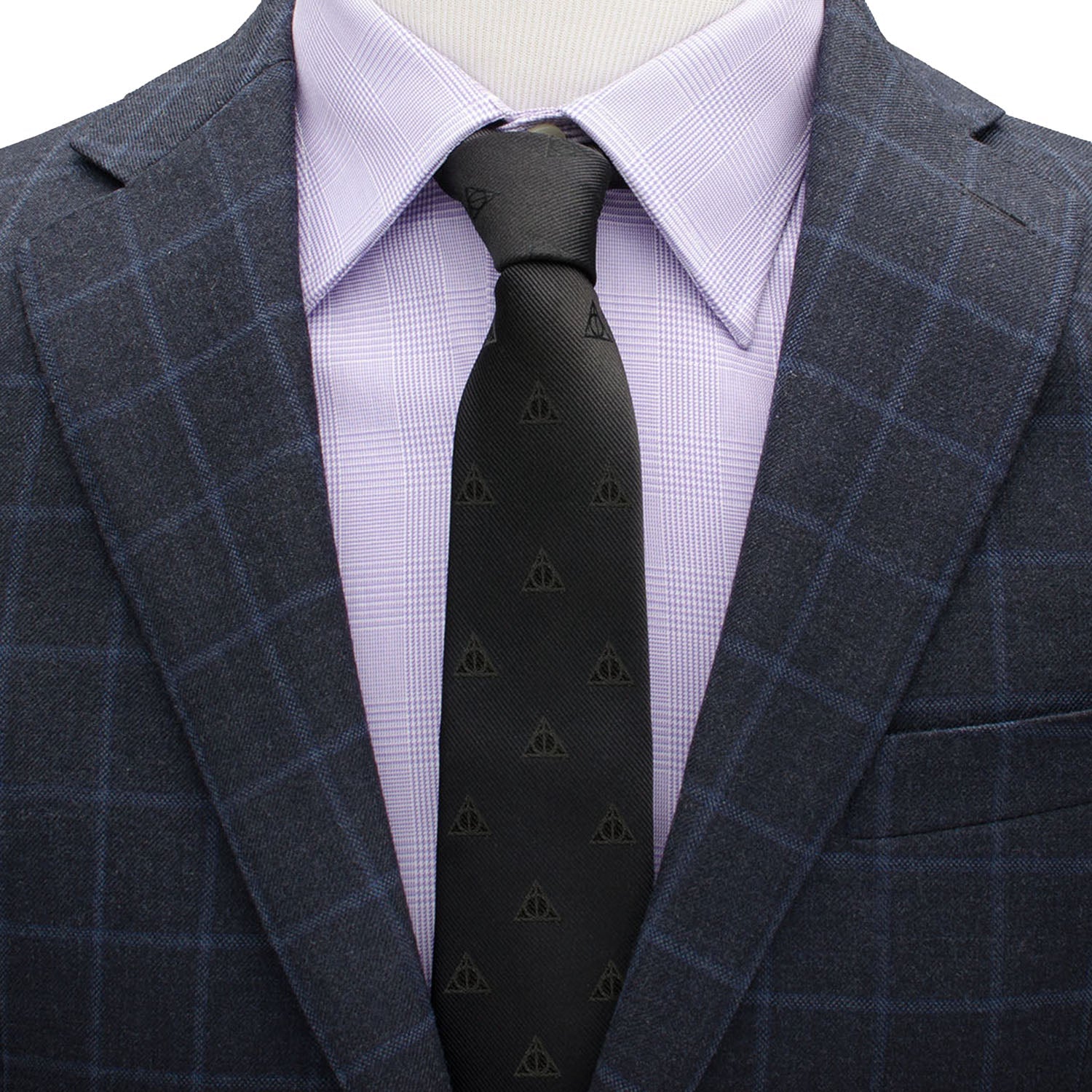 The Harry Potter Deathly Hallows Tie by Cufflinks.com is a black silk tie with a subtle, repeating pattern of small triangle symbols.