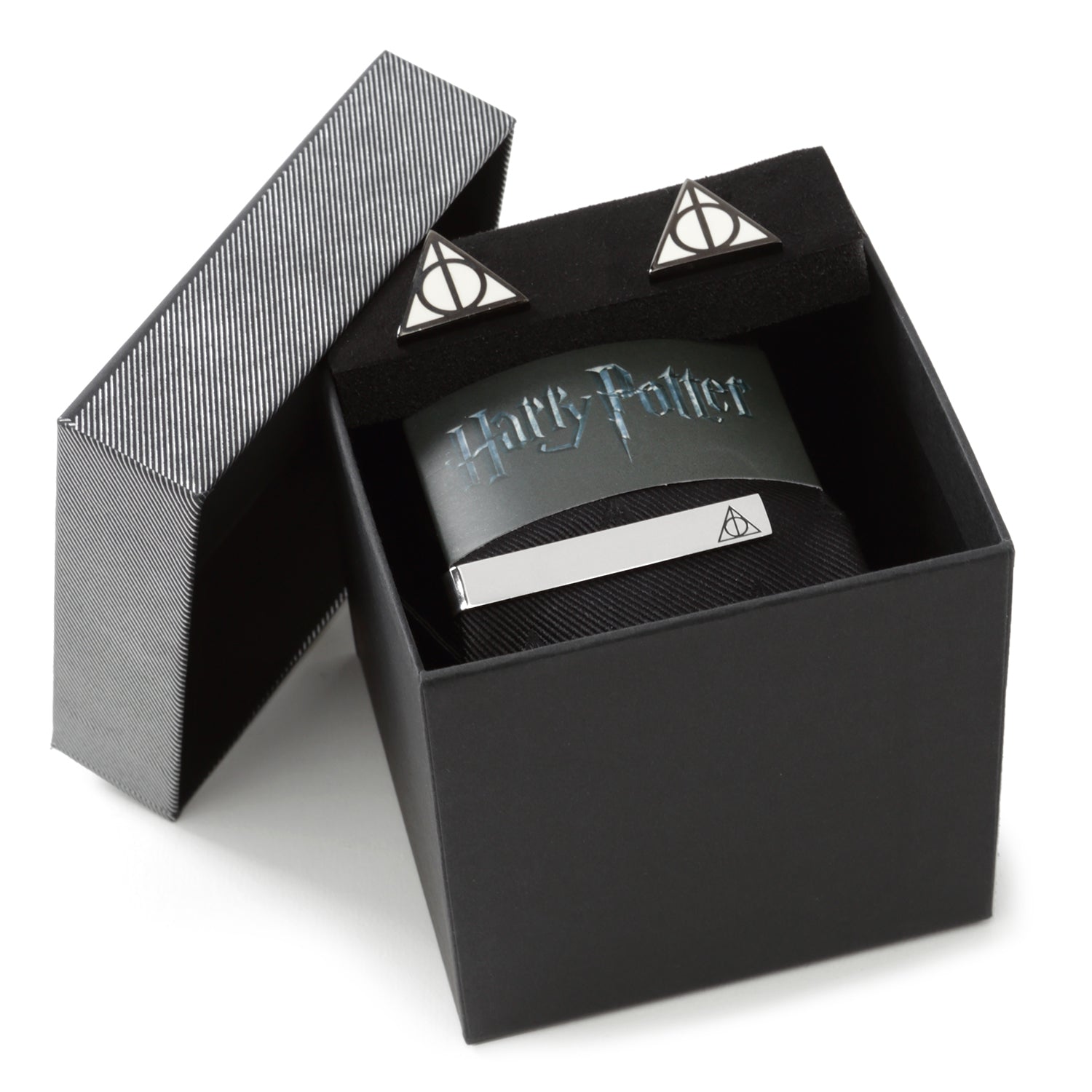 The Harry Potter Deathly Hallows Gift Set by Cufflinks.com includes a black necktie, silver tie clip, and triangular Deathly Hallows cufflinks with the iconic symbol—a perfect stylish gift.