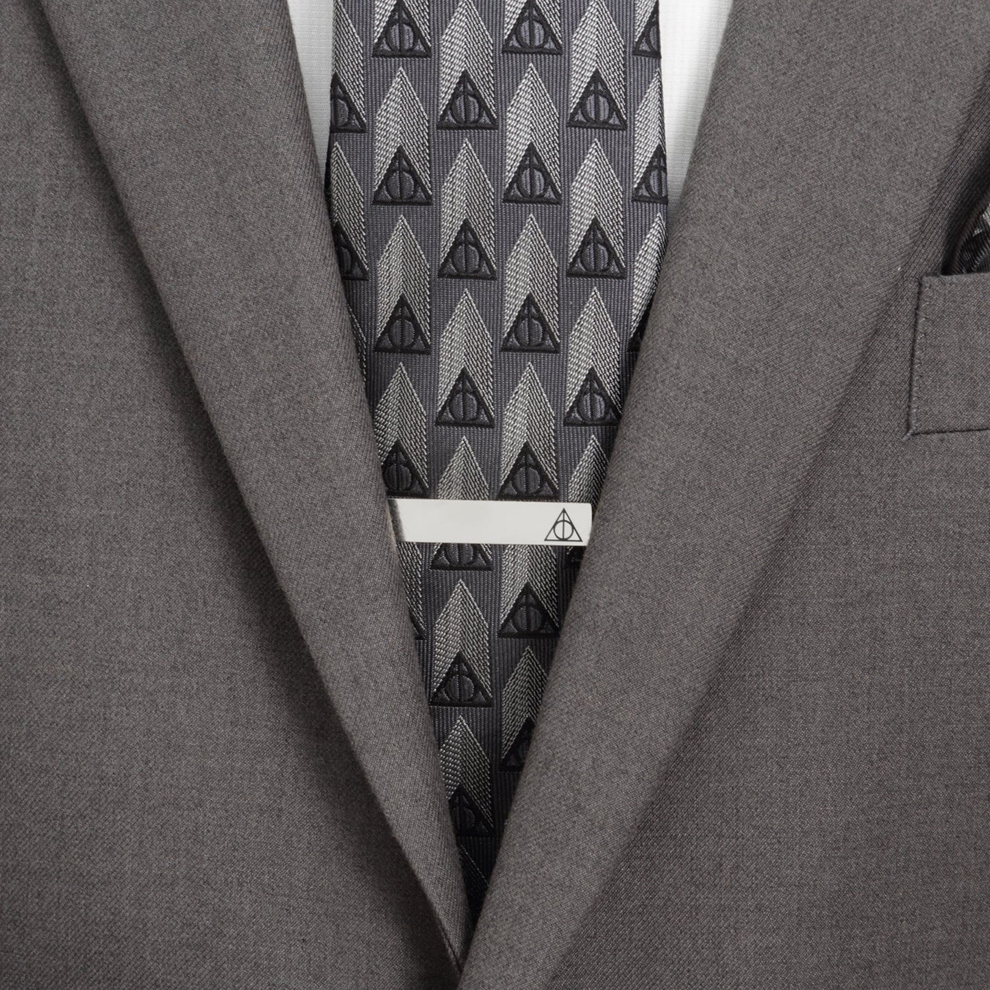 The Harry Potter Deathly Hallows Gift Set by Cufflinks.com includes a black necktie, silver tie clip, and triangular Deathly Hallows cufflinks with the iconic symbol—a perfect stylish gift.