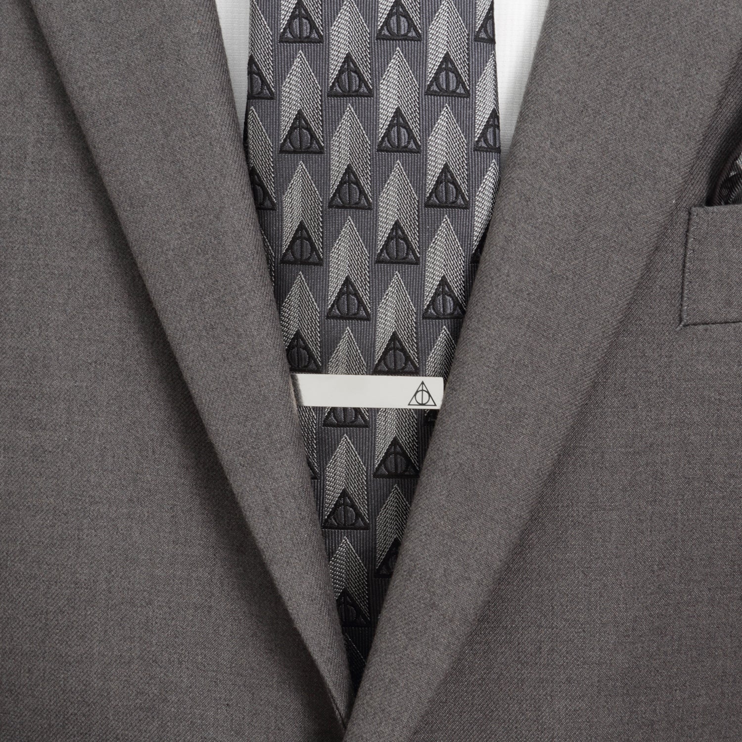 The Harry Potter Deathly Hallows Gift Set by Cufflinks.com includes a black necktie, silver tie clip, and triangular Deathly Hallows cufflinks with the iconic symbol—a perfect stylish gift.