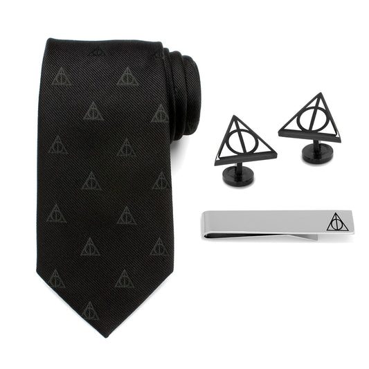 The Harry Potter Deathly Hallows Gift Set by Cufflinks.com includes a black necktie, silver tie clip, and triangular Deathly Hallows cufflinks with the iconic symbol—a perfect stylish gift.