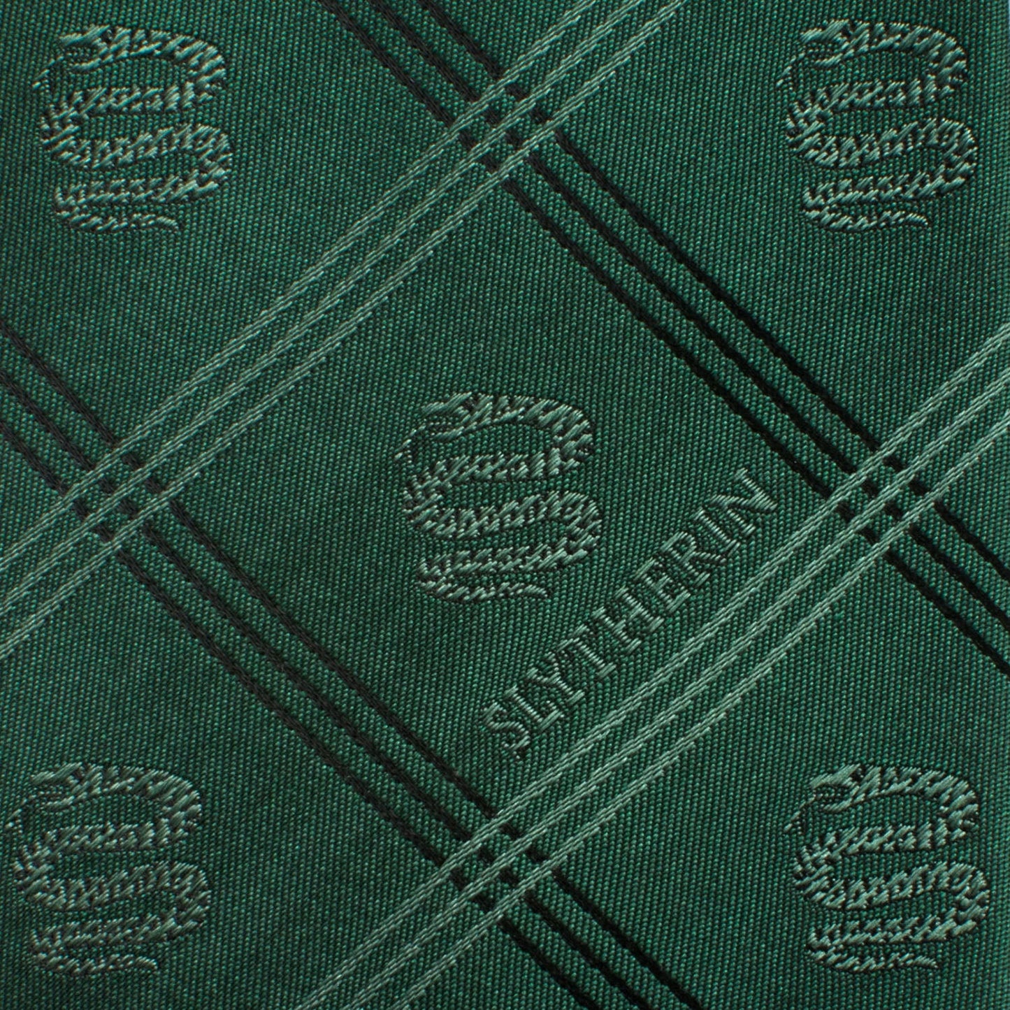 Show your Hogwarts pride with the Harry Potter Slytherin Plaid Tie by Cufflinks.com, featuring green plaid, diagonal stripes, and Slytherin house emblems.