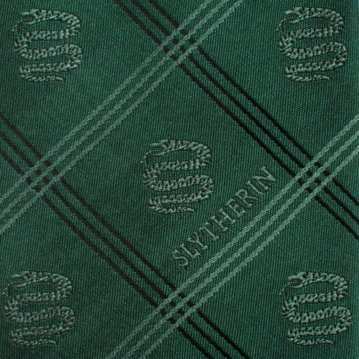 Show your Hogwarts pride with the Harry Potter Slytherin Plaid Tie by Cufflinks.com, featuring green plaid, diagonal stripes, and Slytherin house emblems.