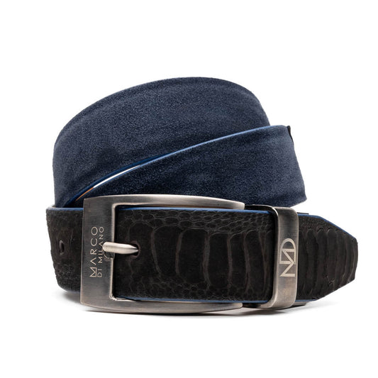 The Hugo Belt Black / Navy by Marco Di Milano, inspired by their signature designs, combines navy suede and black textured leather with a silver logo-engraved buckle, elegantly coiled against a white background.