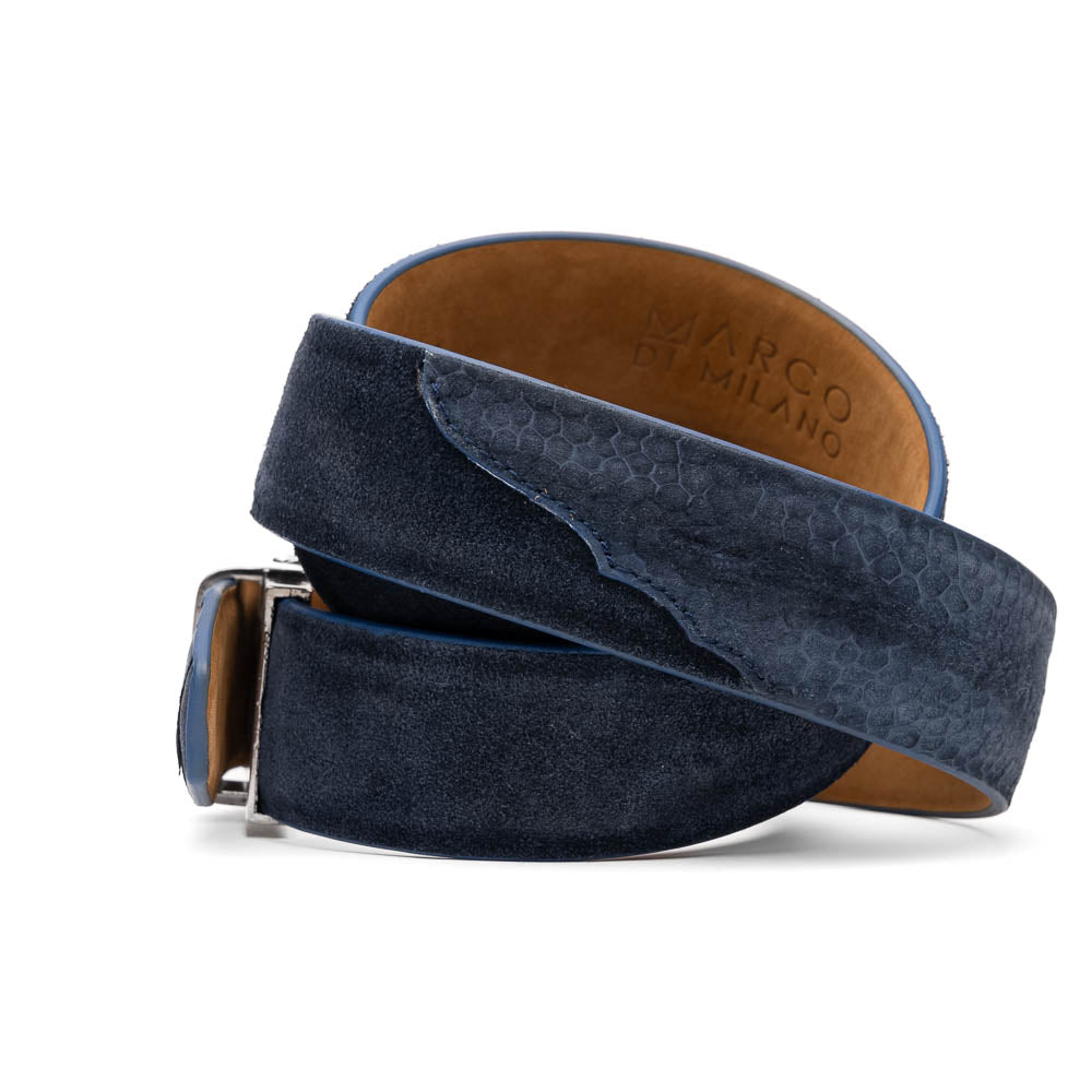 The Hugo Belt Navy by Marco Di Milano features rich blue suede, an ostrich leg finish, and a silver engraved buckle, coiled elegantly—ideal for complementing luxury footwear.