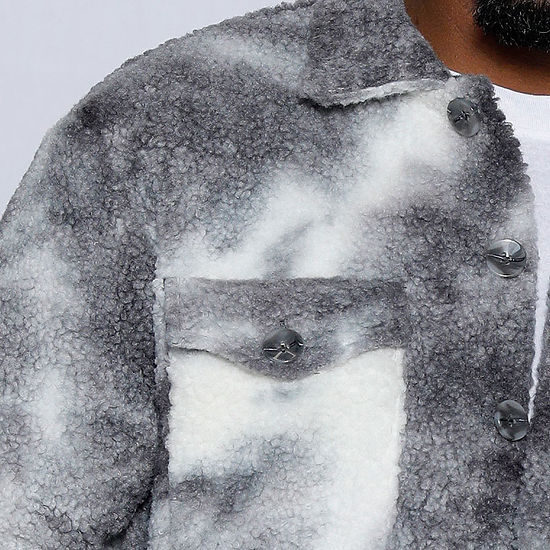 A man wearing an Insomnia MANZINI ICELAND grey soft fleece button sweater shirt stands against a light, decorative background. Made from super soft poly fleece, it requires dry cleaning for optimal care.