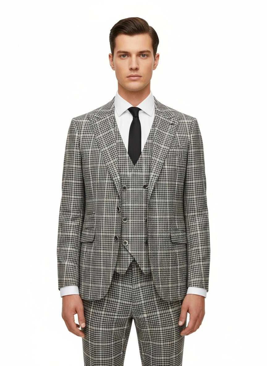 A person stands facing forward, wearing the Tiglio Luxe Green and Navy Glens Plaids Prosecco Modern Fit Pure Wool Suit & Vest TL2715 by Tiglio Luxe, paired with a crisp white shirt and black tie, set against a plain white background.