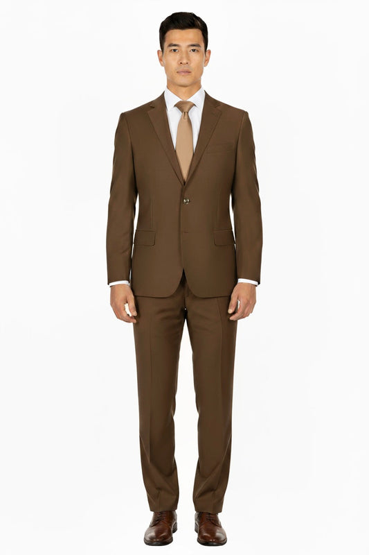 A man stands facing forward wearing the Tobacco Porto Slim Fit, Pure Wool Suit by Tiglio Luxe—tailored from luxury Italian fabrics—paired with brown dress shoes, a white dress shirt, and a tan tie against a plain white background.