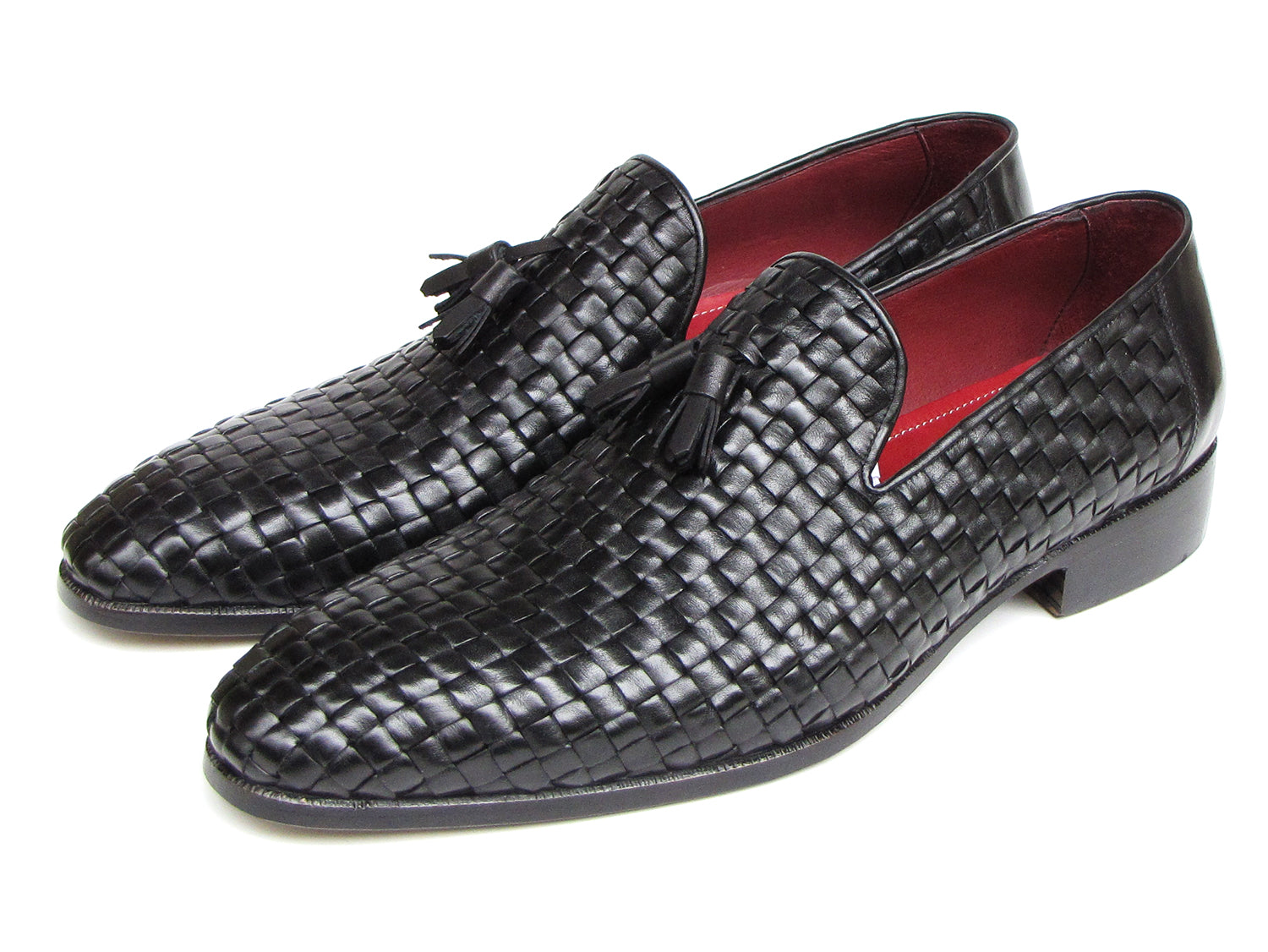 The Paul Parkman Tassel Loafer Black Woven Leather - 085-BLK features black woven leather, red interior lining, and wooden soles—one shoe upright and one on its side to display the elegant men’s footwear from Paul Parkman.