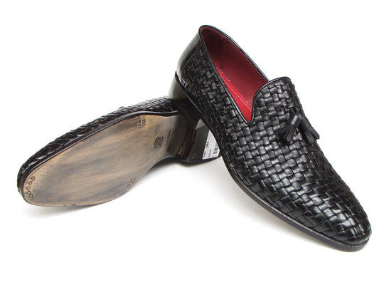 The Paul Parkman Tassel Loafer Black Woven Leather - 085-BLK features black woven leather, red interior lining, and wooden soles—one shoe upright and one on its side to display the elegant men’s footwear from Paul Parkman.