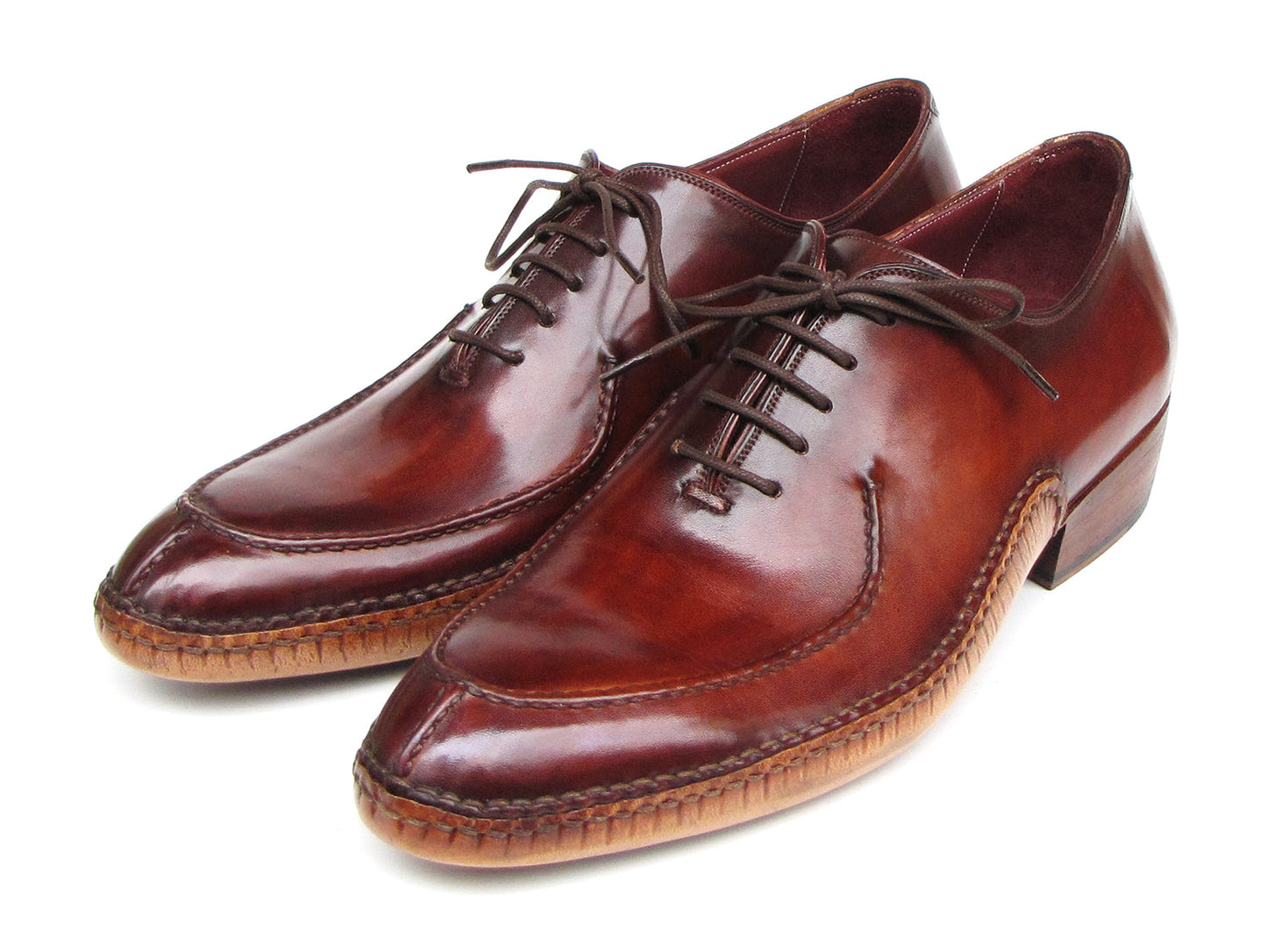 The Paul Parkman Side Handsewn Split-toe Burgundy Oxfords - 054-BUR feature polished hand-painted leather, lace-up design, and elegant stitching details for a refined men's footwear look.