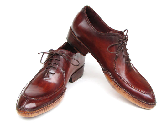 The Paul Parkman Side Handsewn Split-toe Burgundy Oxfords - 054-BUR feature polished hand-painted leather, lace-up design, and elegant stitching details for a refined men's footwear look.