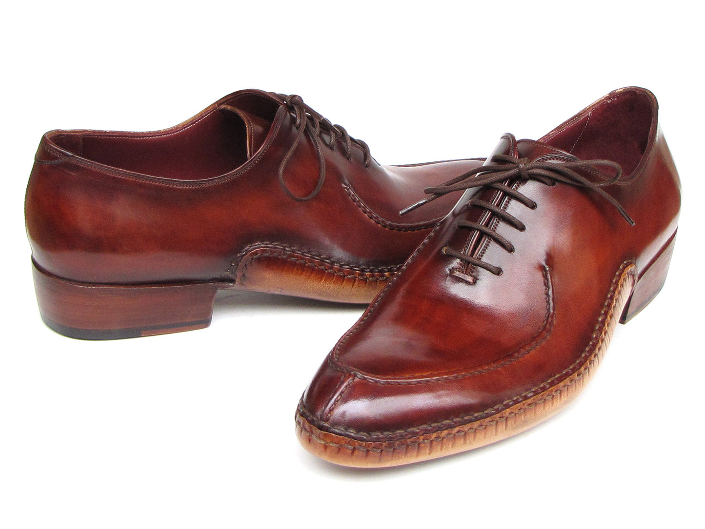 The Paul Parkman Side Handsewn Split-toe Burgundy Oxfords - 054-BUR feature polished hand-painted leather, lace-up design, and elegant stitching details for a refined men's footwear look.