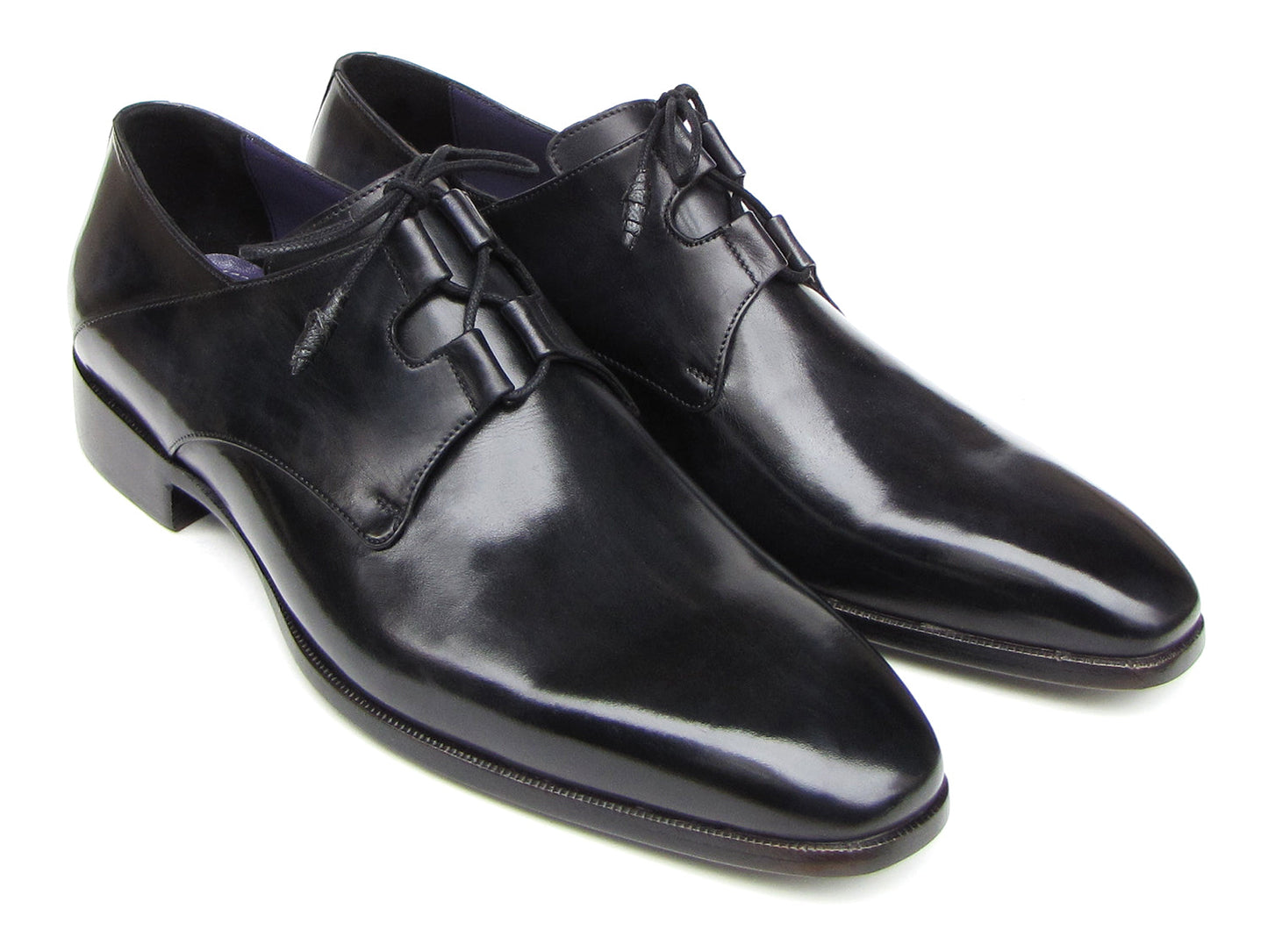 A pair of Paul Parkman Ghillie Lacing Plain Toe Black Shoes (076-BLK)—one shoe stands upright while the other rests on its side.