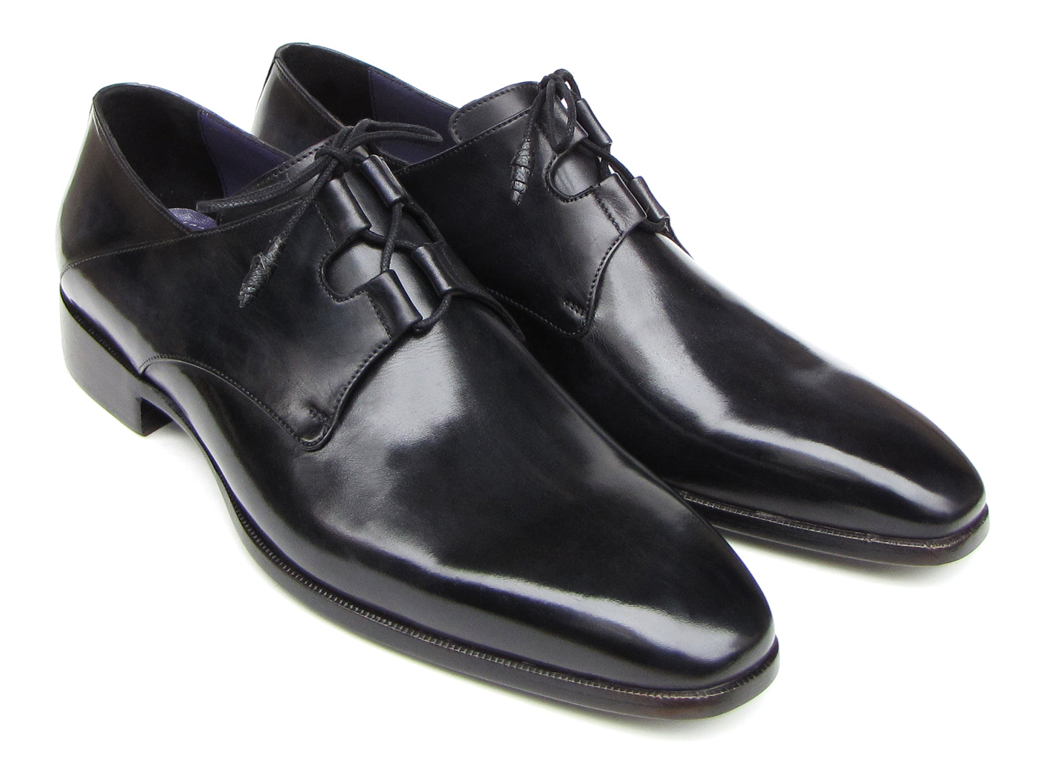 A pair of Paul Parkman Ghillie Lacing Plain Toe Black Shoes (076-BLK)—one shoe stands upright while the other rests on its side.