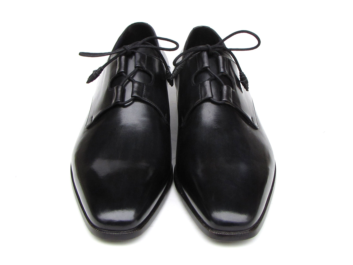 A pair of Paul Parkman Ghillie Lacing Plain Toe Black Shoes (076-BLK)—one shoe stands upright while the other rests on its side.