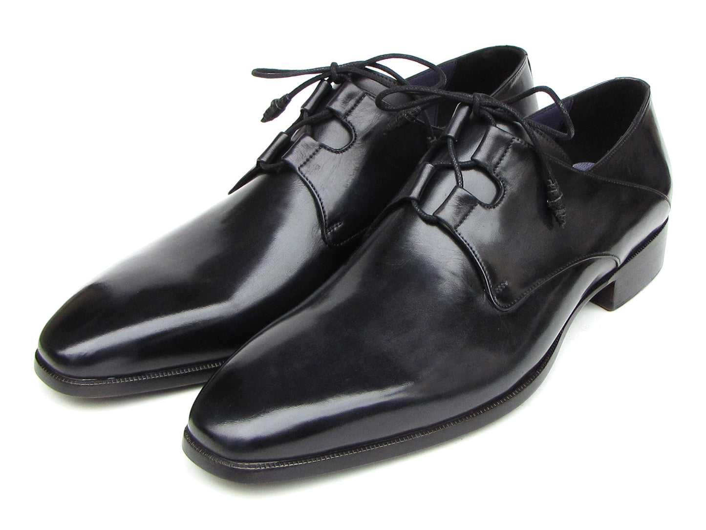 A pair of Paul Parkman Ghillie Lacing Plain Toe Black Shoes (076-BLK)—one shoe stands upright while the other rests on its side.