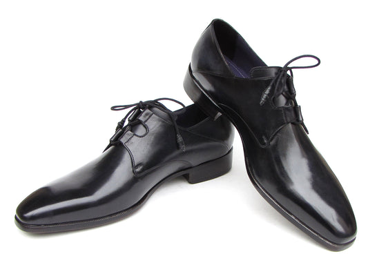 A pair of Paul Parkman Ghillie Lacing Plain Toe Black Shoes (076-BLK)—one shoe stands upright while the other rests on its side.