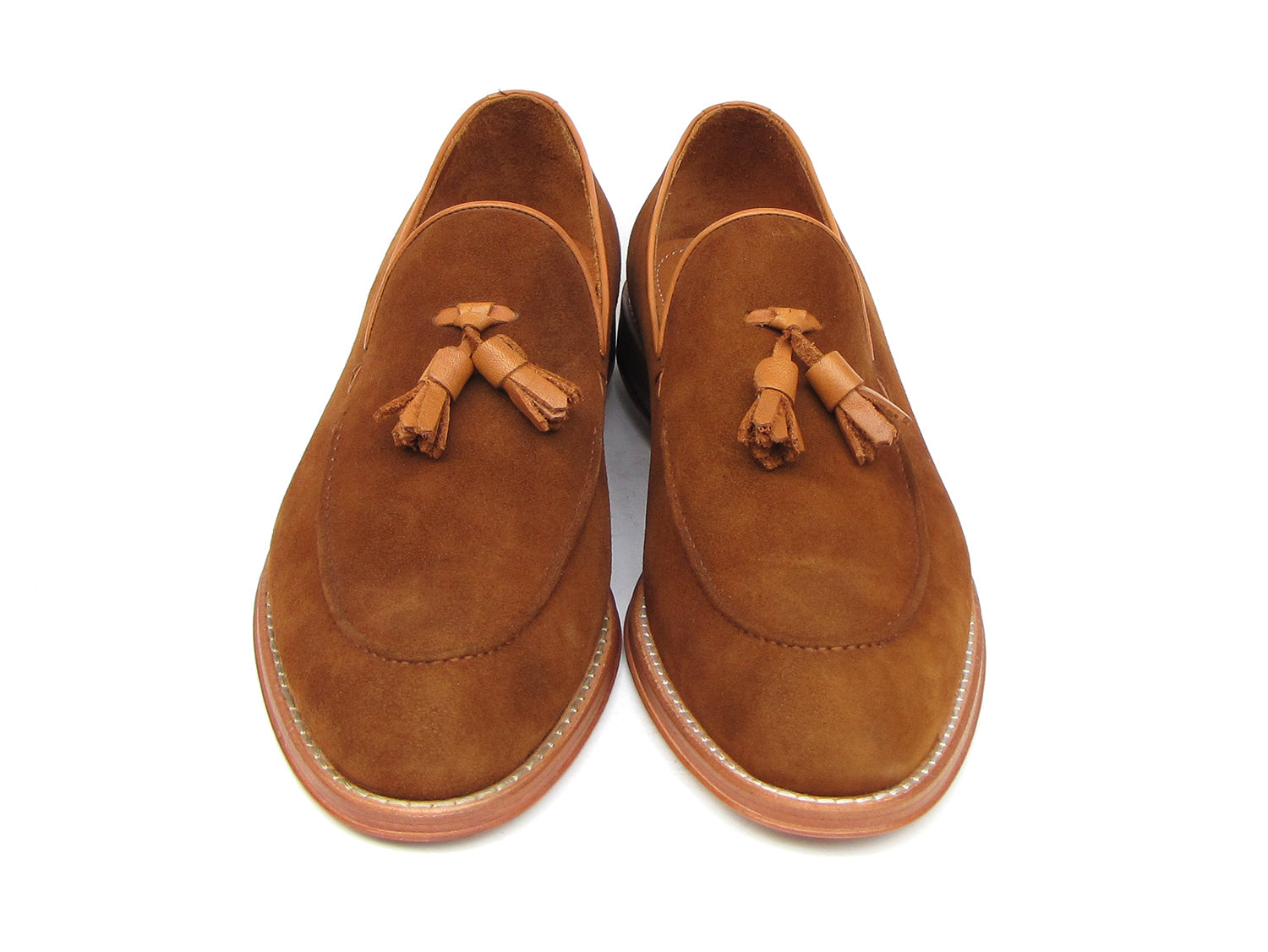 Paul Parkman Tassel Loafers Tobacco Suede - 087-TAB by Paul Parkman: one loafer stands upright while the other lies on its side, showing the leather sole.