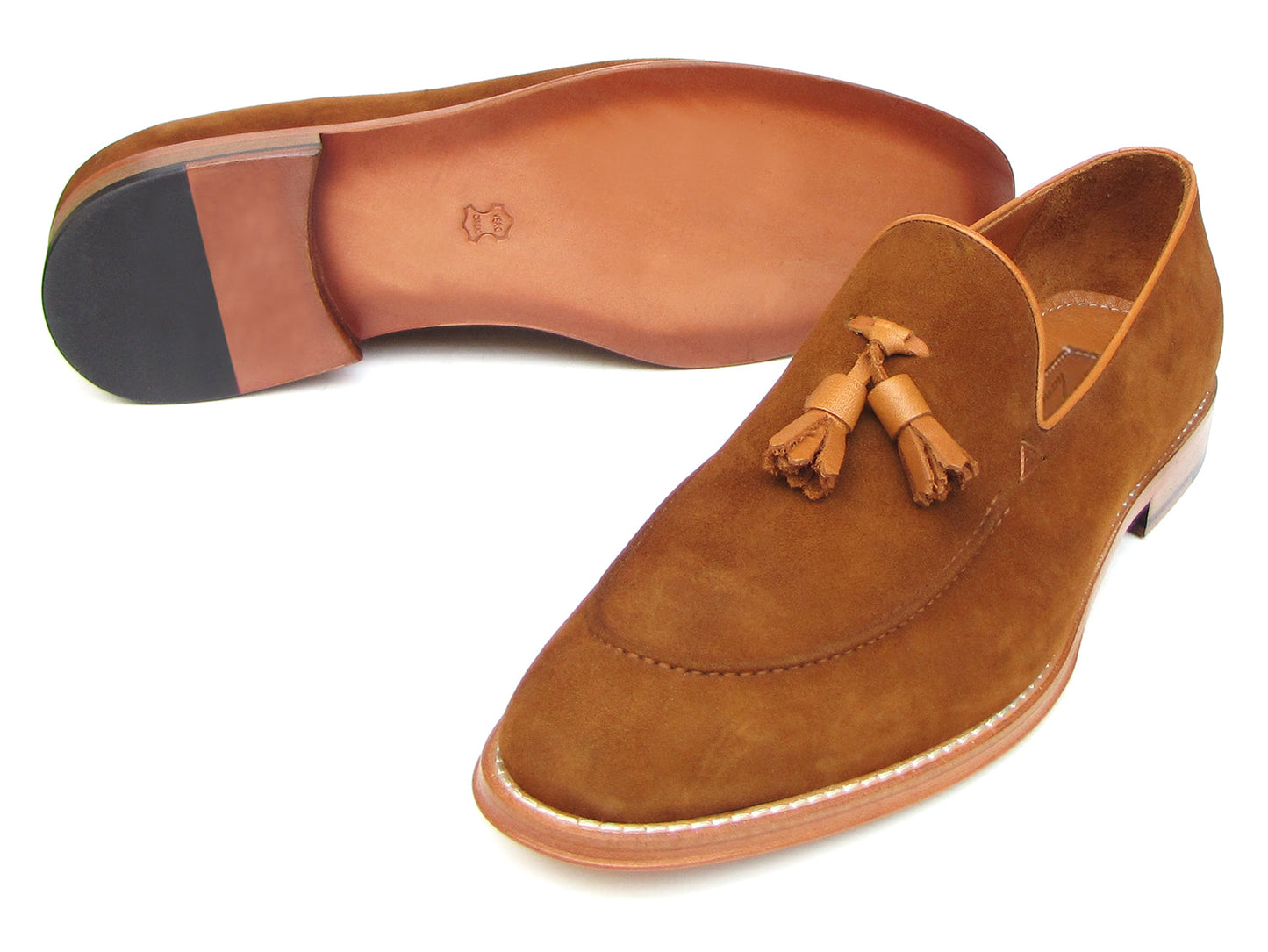 Paul Parkman Tassel Loafers Tobacco Suede - 087-TAB by Paul Parkman: one loafer stands upright while the other lies on its side, showing the leather sole.