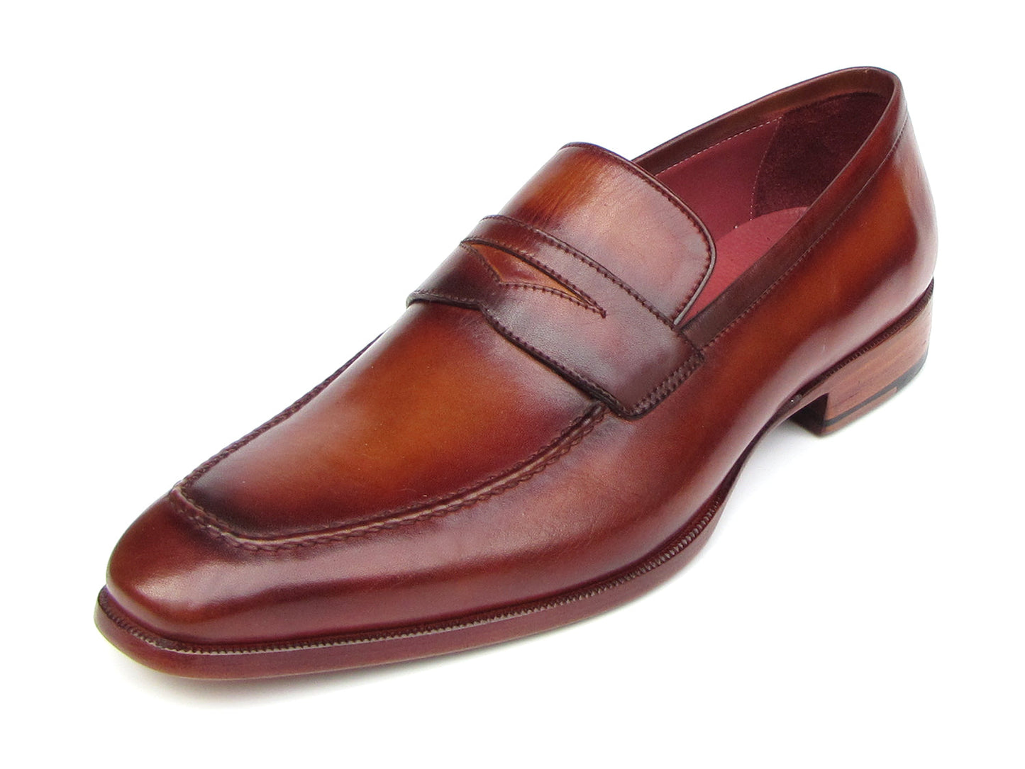 The Paul Parkman Penny Loafer Tobacco & Bordeaux Hand-Painted Shoes (067-BRD) for men feature brown leather, visible stitching, a wooden heel, and a branded insole, combining classic style with expert craftsmanship.