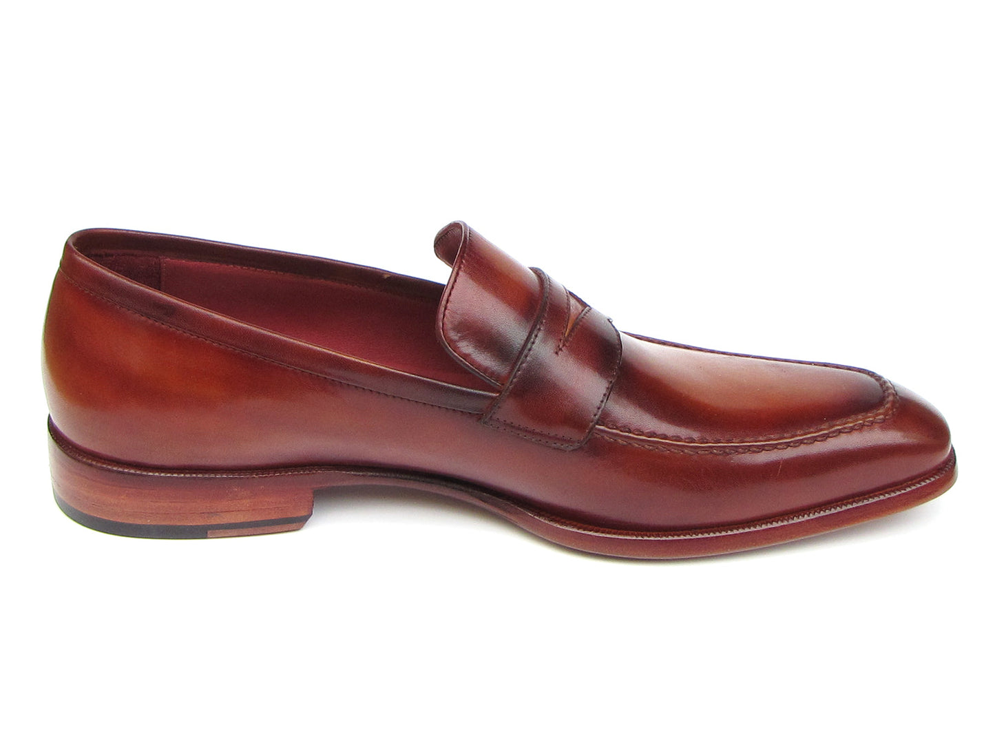 The Paul Parkman Penny Loafer Tobacco & Bordeaux Hand-Painted Shoes (067-BRD) for men feature brown leather, visible stitching, a wooden heel, and a branded insole, combining classic style with expert craftsmanship.