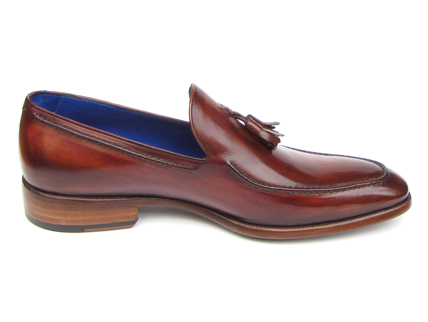 The Paul Parkman Tassel Loafer Brown - 073-BRD features hand-painted brown Italian calfskin, blue inner lining, wooden soles, and the "Paul Parkman handmade shoes" label for timeless elegance.