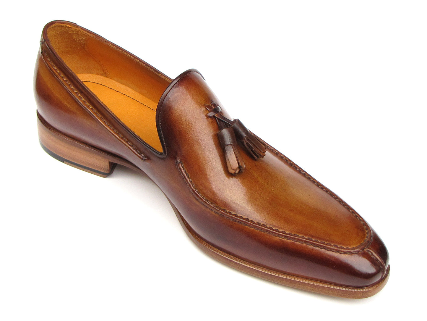 The Paul Parkman Tassel Loafer Camel & Brown Hand-Painted - 083-CML features a polished finish, low heel, and elegant hand-painted leather—shown from a slightly angled side view—making it a sophisticated men's shoe choice.
