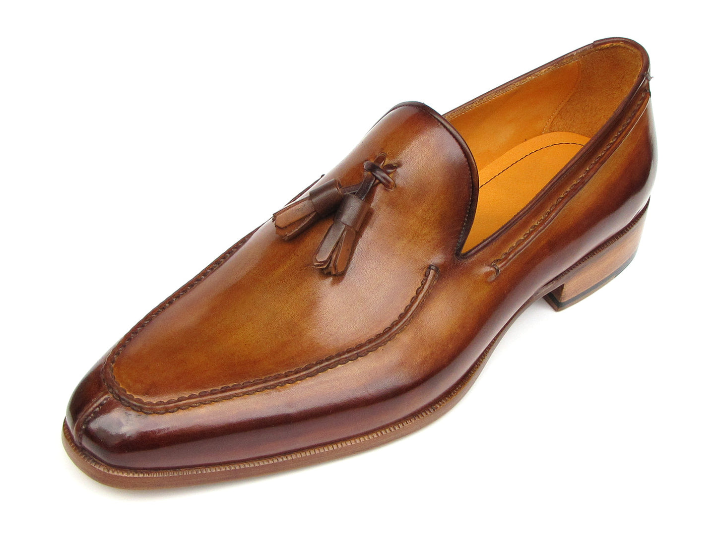 The Paul Parkman Tassel Loafer Camel & Brown Hand-Painted - 083-CML features a polished finish, low heel, and elegant hand-painted leather—shown from a slightly angled side view—making it a sophisticated men's shoe choice.
