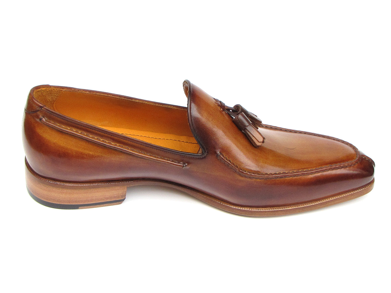 The Paul Parkman Tassel Loafer Camel & Brown Hand-Painted - 083-CML features a polished finish, low heel, and elegant hand-painted leather—shown from a slightly angled side view—making it a sophisticated men's shoe choice.