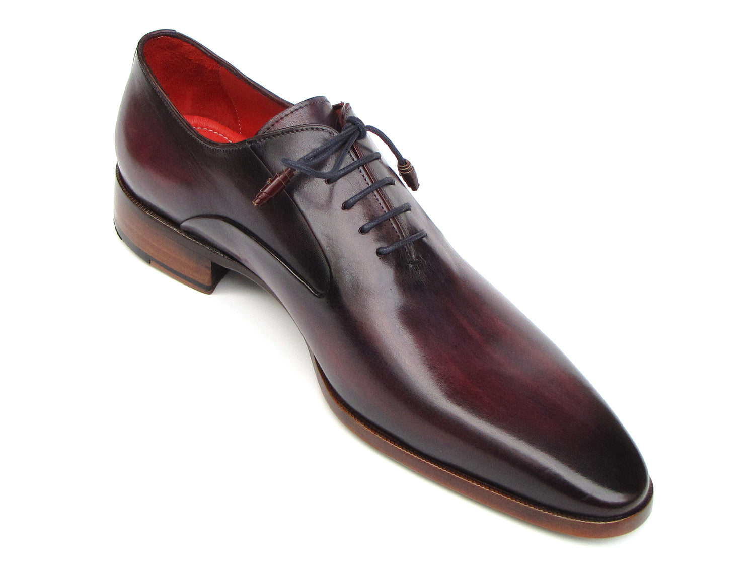 A single Paul Parkman Plain Toe Oxfords Purple Shoe for men, handmade with a sleek design, red interior lining, and brown wooden heel, viewed from an angle.