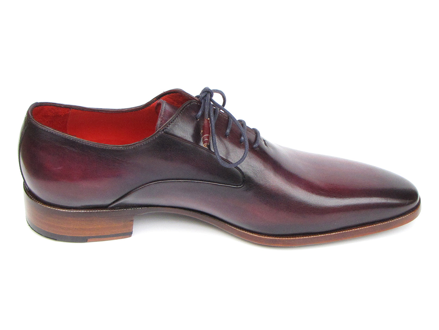 A single Paul Parkman Plain Toe Oxfords Purple Shoe for men, handmade with a sleek design, red interior lining, and brown wooden heel, viewed from an angle.