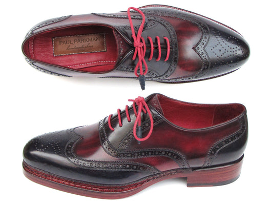 Paul Parkman Triple Leather Sole Wingtip Brogues in navy and red, featuring intricate brogue detailing, bold red interior lining, and stylish red laces.