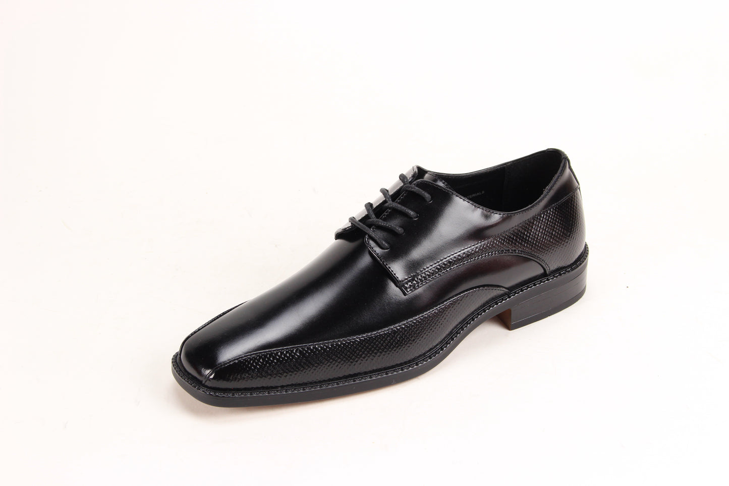 The Giorgio Venturi 7060 Black Leather Shoe features a bike toe, lace-up design, low heel, and embossed textured detailing on the sides and around the sole.