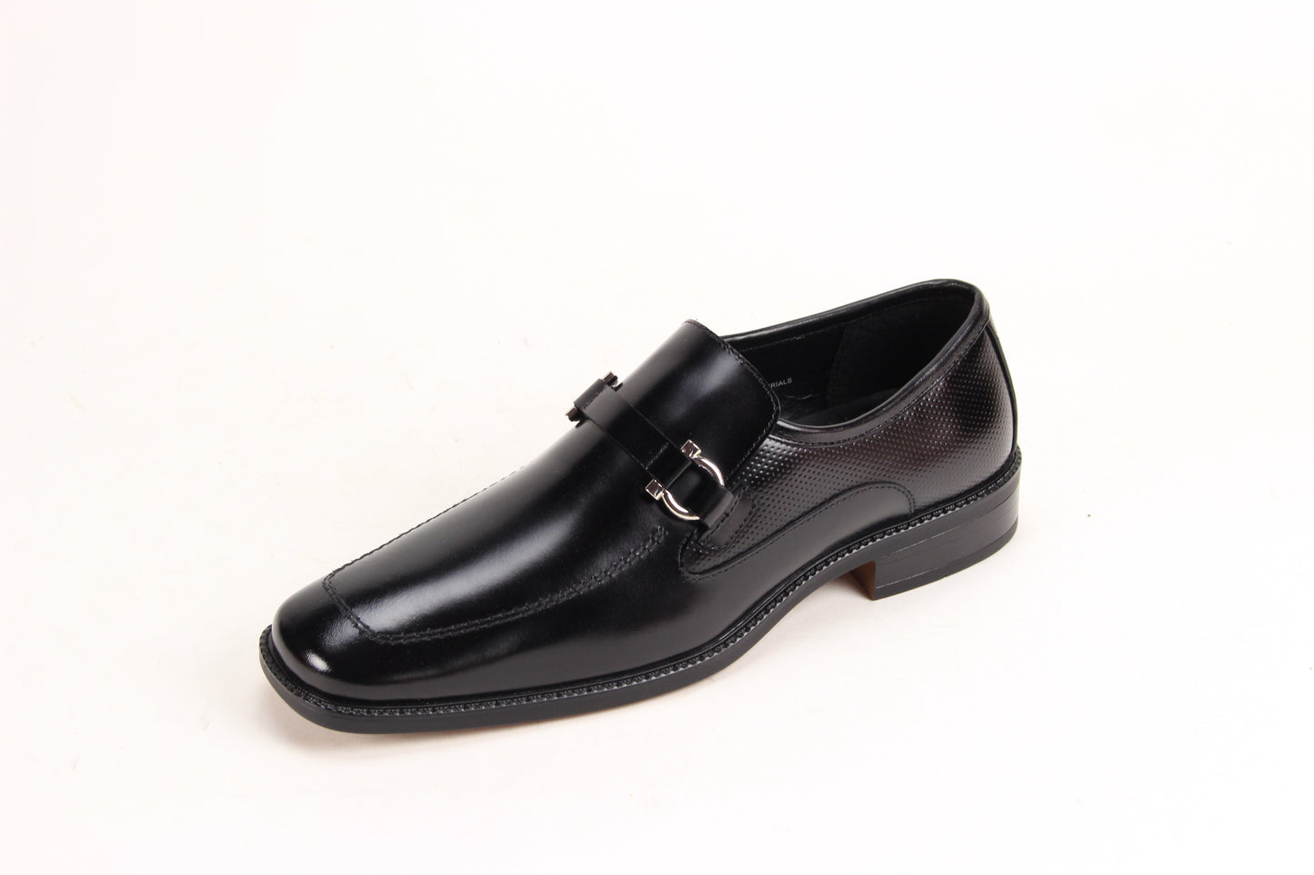 The Giorgio Venturi 7061 Black Leather Shoes feature smooth black leather, a silver buckle, low heel, and square toe, displayed against a white background.
