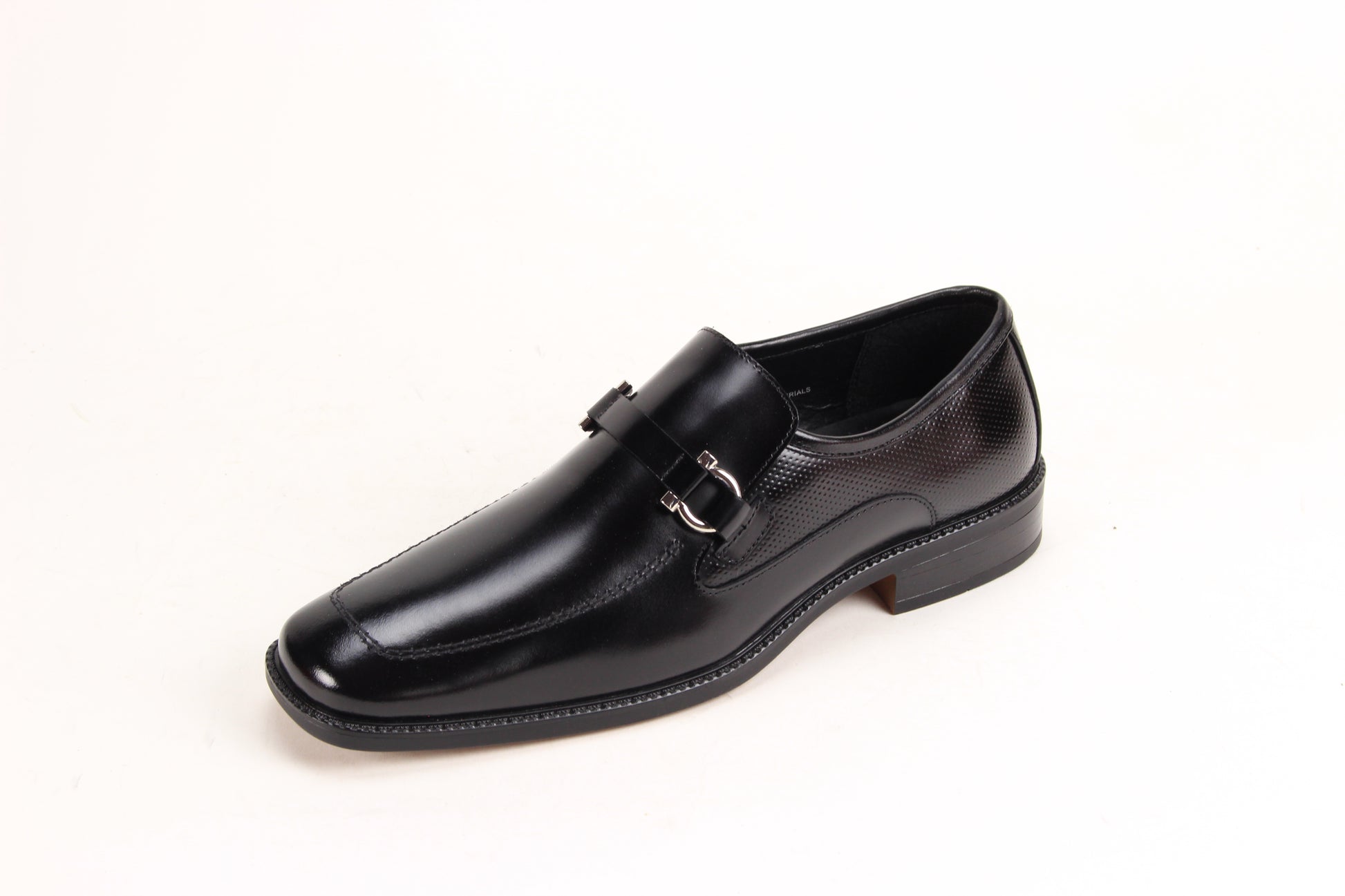 The Giorgio Venturi 7061 Black Leather Shoes feature smooth black leather, a silver buckle, low heel, and square toe, displayed against a white background.