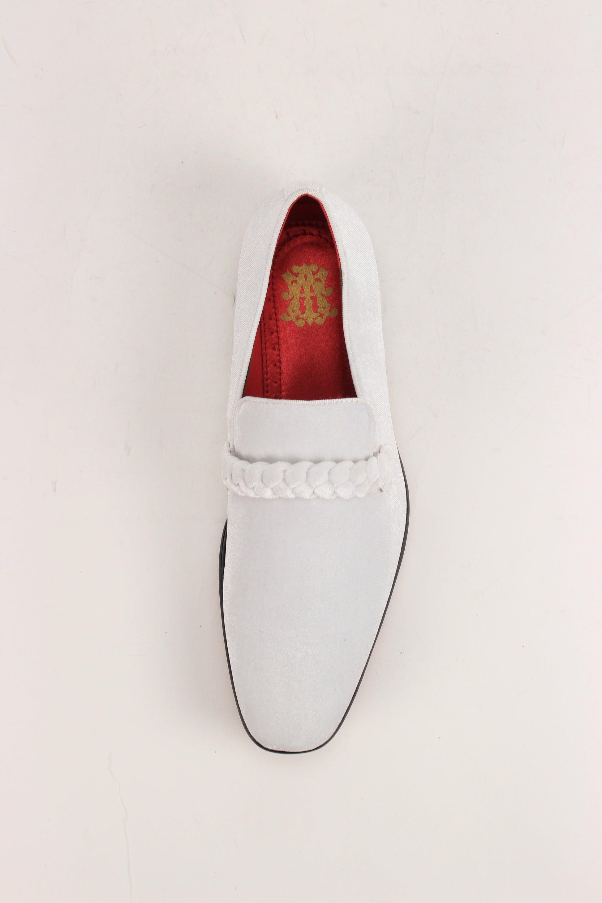 The AFTER MIDNIGHT After Midnight 7067 White Dress Shoe is a single white suede loafer with a braided strap, plain toe, black sole, and red interior lining.