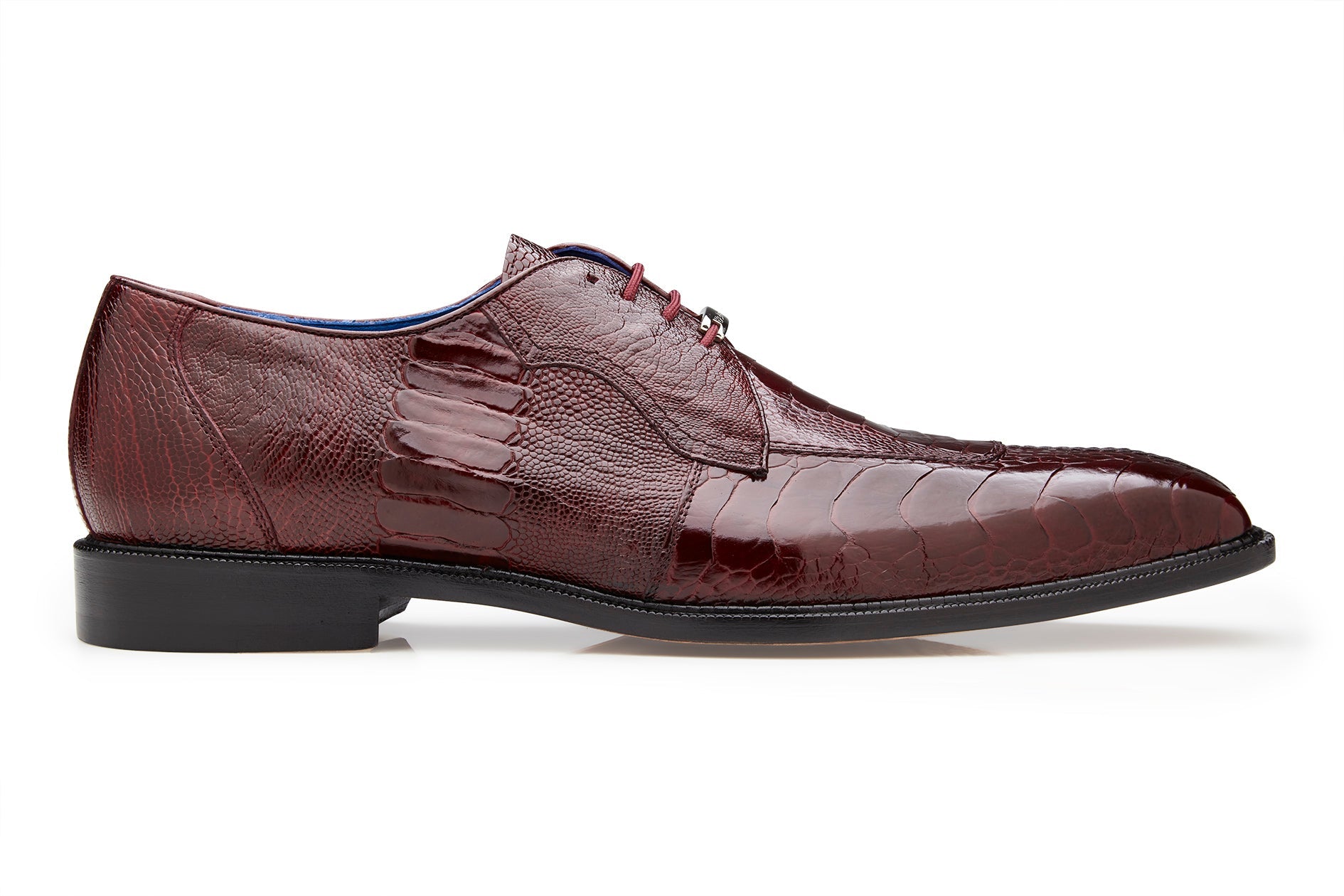 A side view of the BELVEDERE Siena dress shoe, genuine ostrich leg in dark burgundy (1463), featuring a textured pattern, moc toe design, and black sole against a white background.