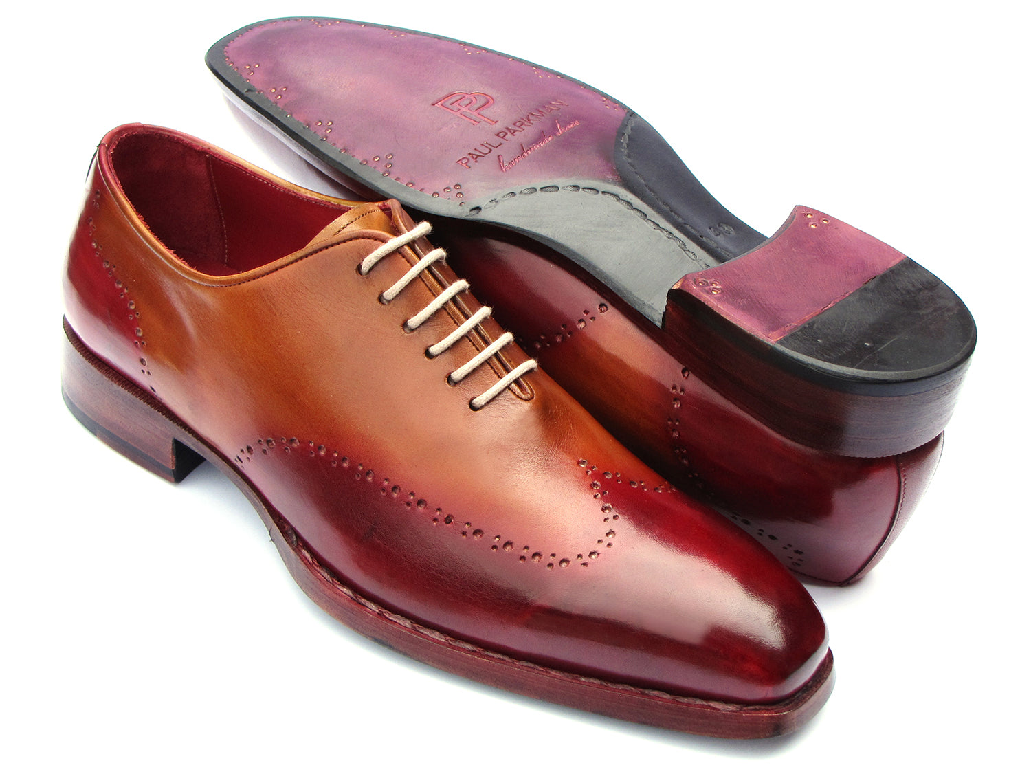 The Paul Parkman Goodyear Welted Wingtip Oxfords Bordeaux & Camel - 081-RDT feature two-tone brown and burgundy hues with brogue detailing, shown on a white background.