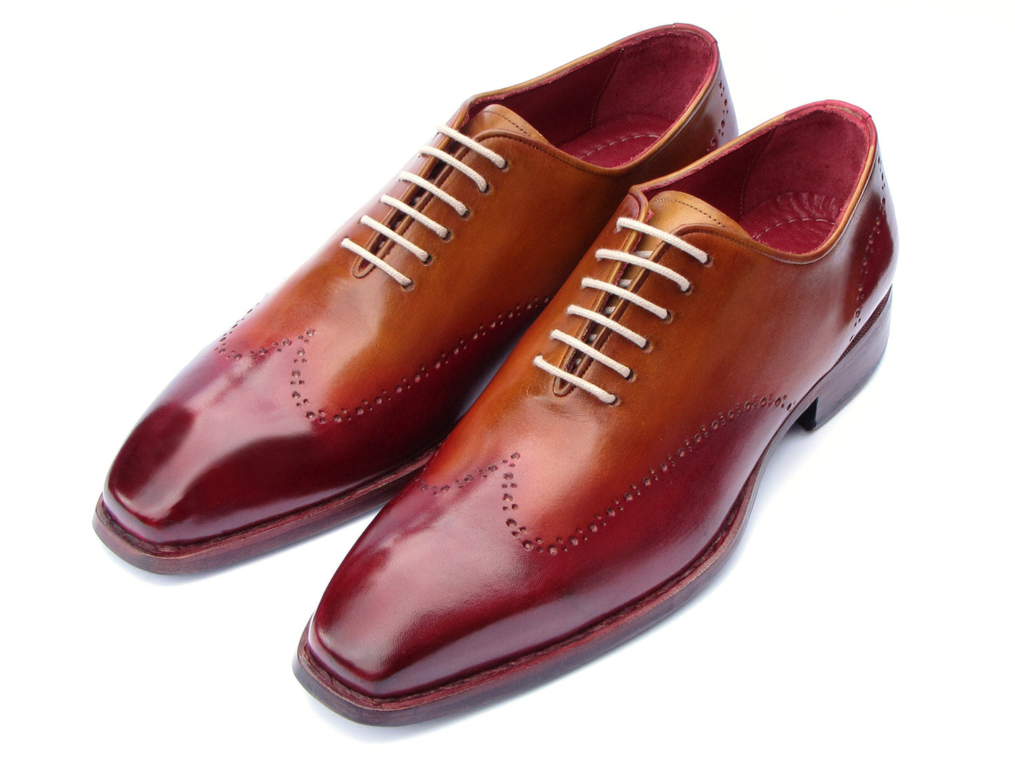 The Paul Parkman Goodyear Welted Wingtip Oxfords Bordeaux & Camel - 081-RDT feature two-tone brown and burgundy hues with brogue detailing, shown on a white background.