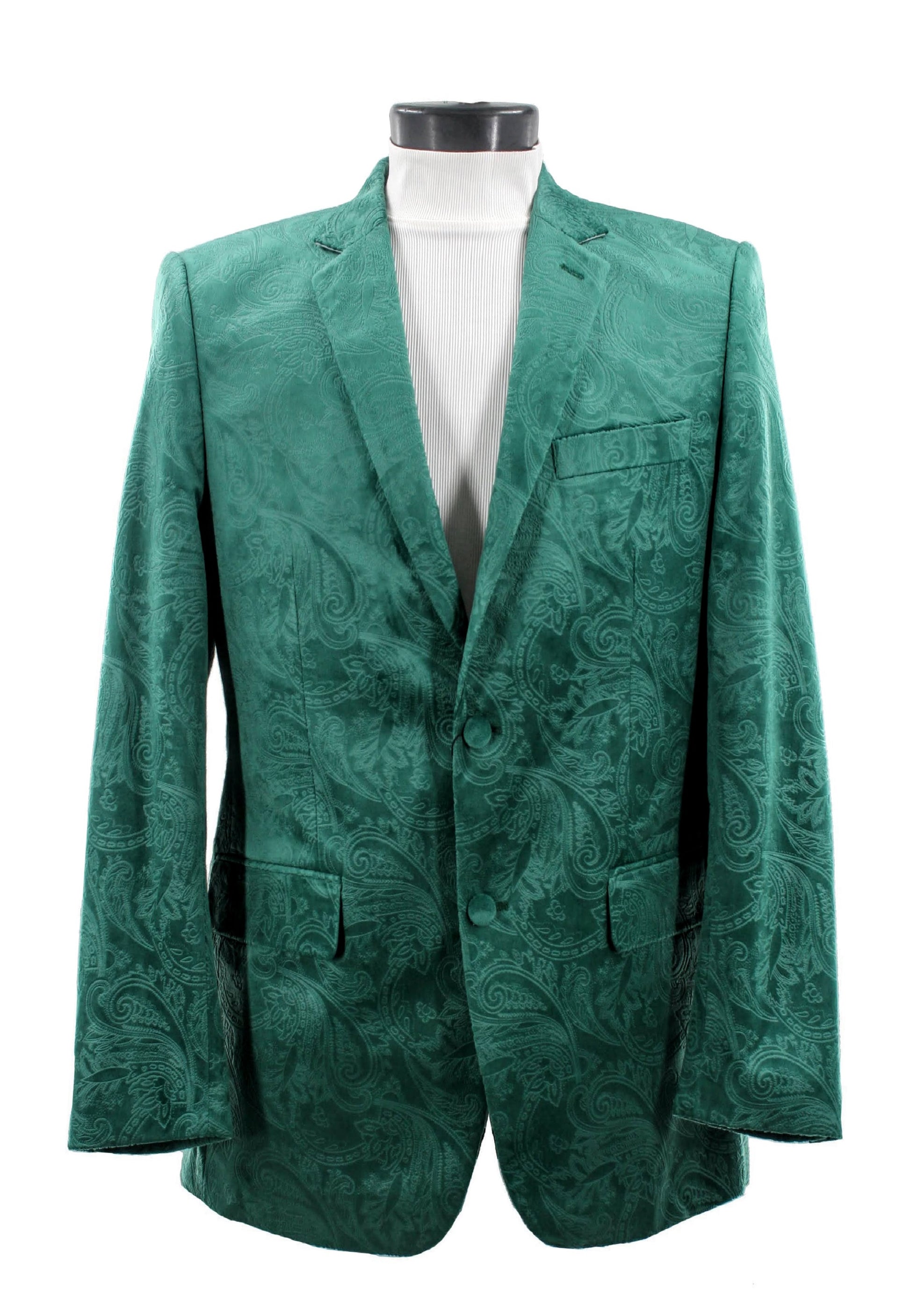 The Bassiri Blazer J1044-H Green, featuring a green paisley design, drapes elegantly over the mannequin to reveal a chic white turtleneck underneath.