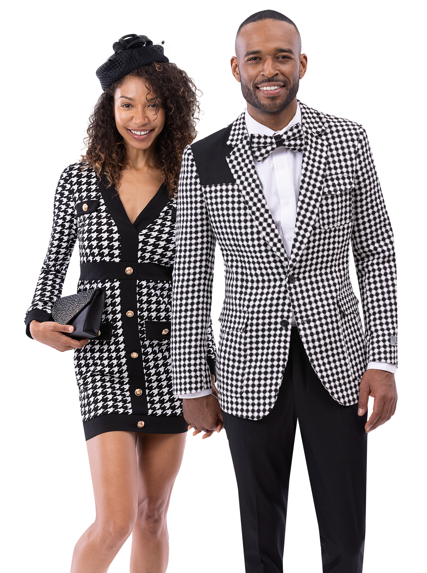 A man and woman smile, showcasing EJ SAMUEL's EJ Samuel Blk/White Suit JP122 in matching houndstooth patterns; she wears a dress, while he sports the blazer.