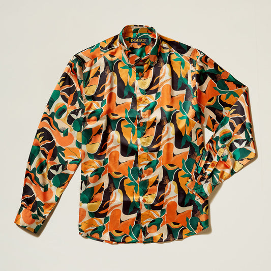 The Inserch LS Tropics Print Shirt LS050-00029 Orange is a long-sleeve, button-up satin weave shirt featuring a bold multicolored abstract pattern in orange, green, yellow, and black with pearlized buttons. Brand: Inserch.