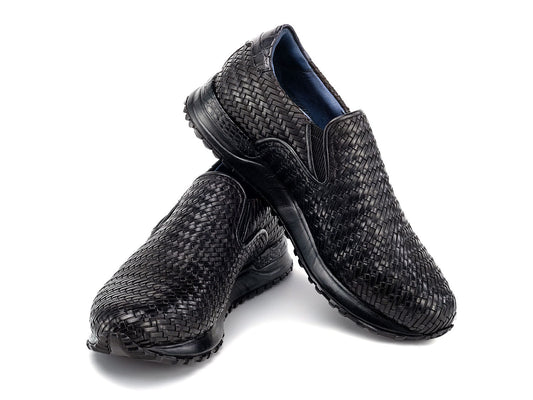 Paul Parkman Men's Black Woven Leather Slip-On Sneakers (LW204BLK) are shown against a white background, featuring stylish textured soles with one shoe resting atop the other.