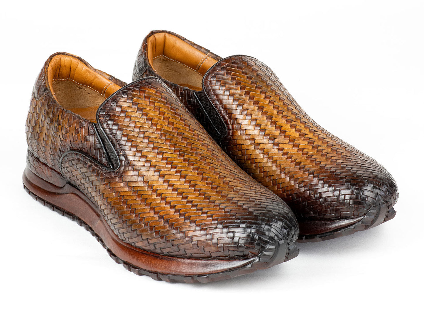A pair of Paul Parkman Men's Brown Woven Leather Slip-On Sneakers (LW204BRW) featuring a textured sole and tan lining.