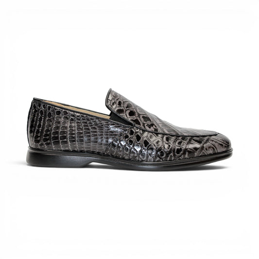 The Fennix Lance Nero/Grigio by Fennix of Italy is a black crocodile-pattern leather loafer, Italian-crafted for sophistication with a low heel and rounded toe, displayed in profile against a plain white background.