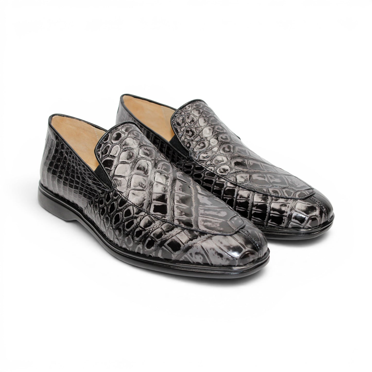 The Fennix Lance Nero/Grigio by Fennix of Italy is a black crocodile-pattern leather loafer, Italian-crafted for sophistication with a low heel and rounded toe, displayed in profile against a plain white background.