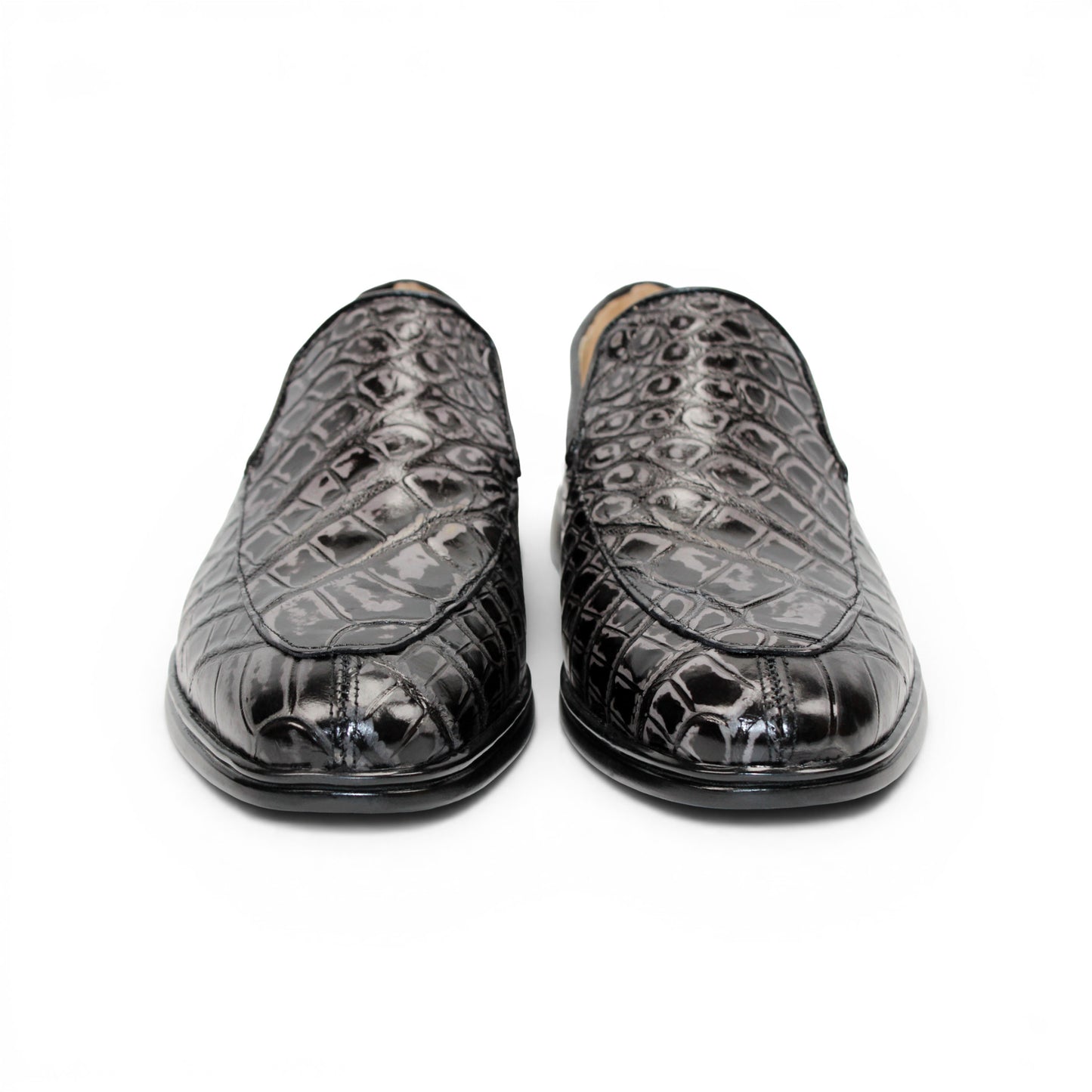 The Fennix Lance Nero/Grigio by Fennix of Italy is a black crocodile-pattern leather loafer, Italian-crafted for sophistication with a low heel and rounded toe, displayed in profile against a plain white background.