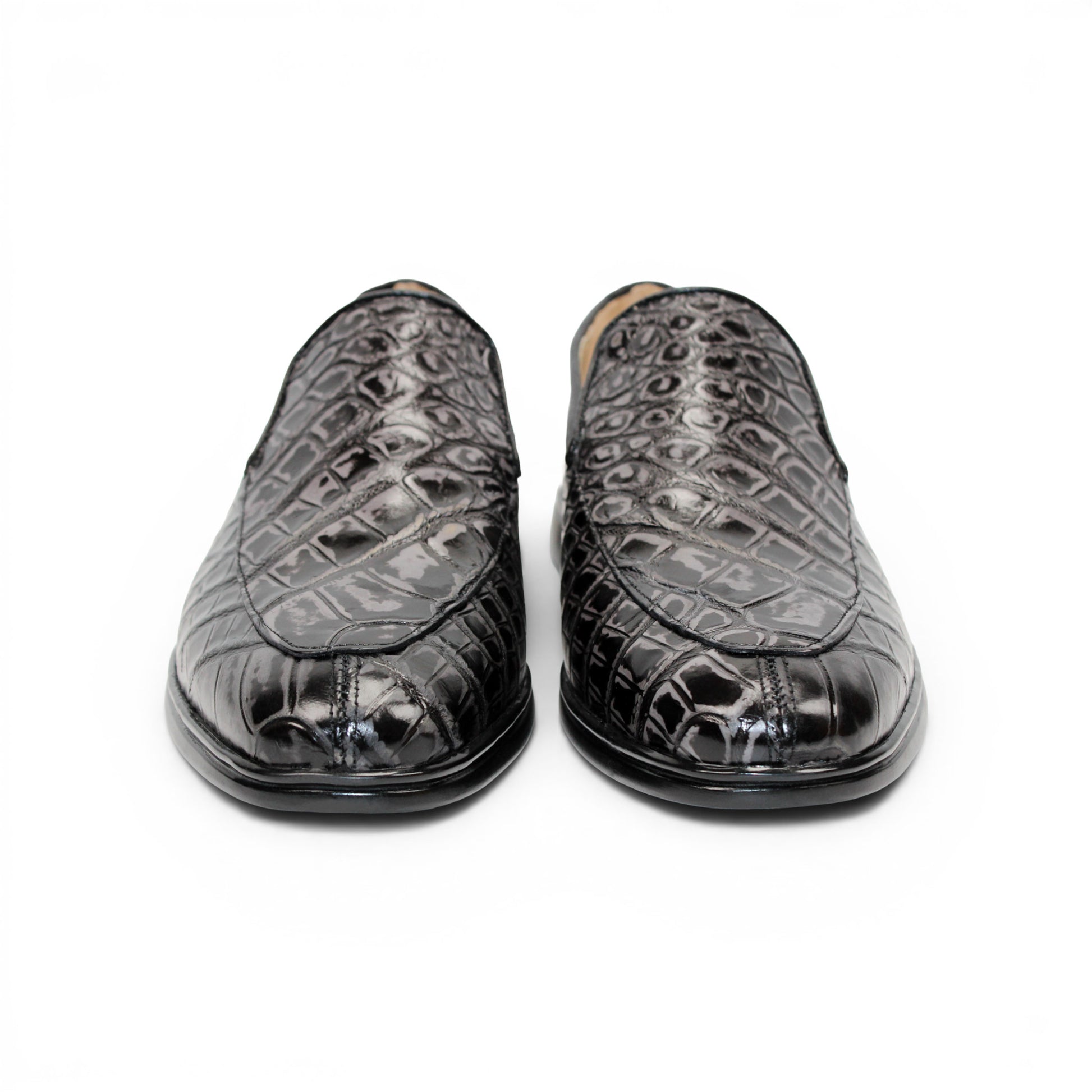The Fennix Lance Nero/Grigio by Fennix of Italy is a black crocodile-pattern leather loafer, Italian-crafted for sophistication with a low heel and rounded toe, displayed in profile against a plain white background.