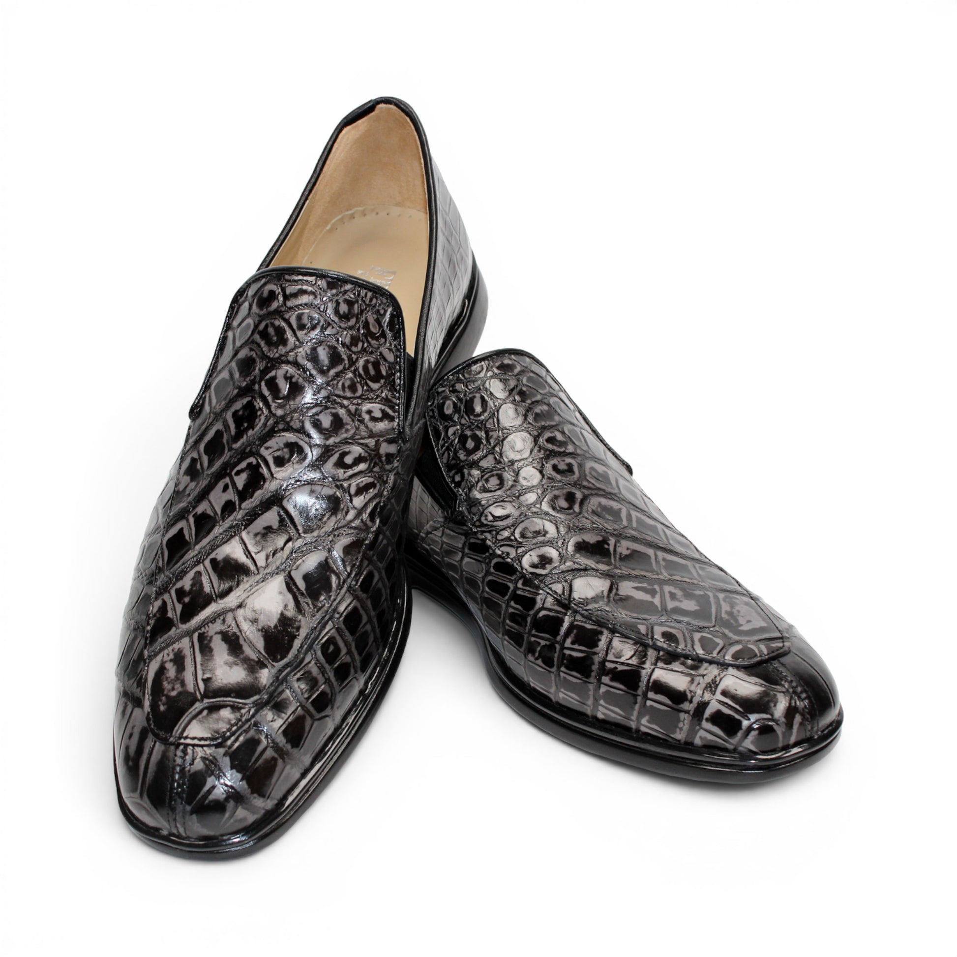 The Fennix Lance Nero/Grigio by Fennix of Italy is a black crocodile-pattern leather loafer, Italian-crafted for sophistication with a low heel and rounded toe, displayed in profile against a plain white background.